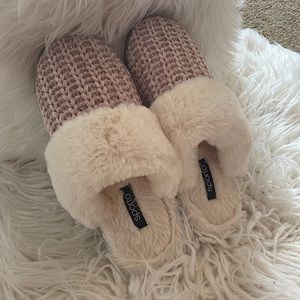 Pink and white slippers from Sporto. They are size large or size 9-10 in women.